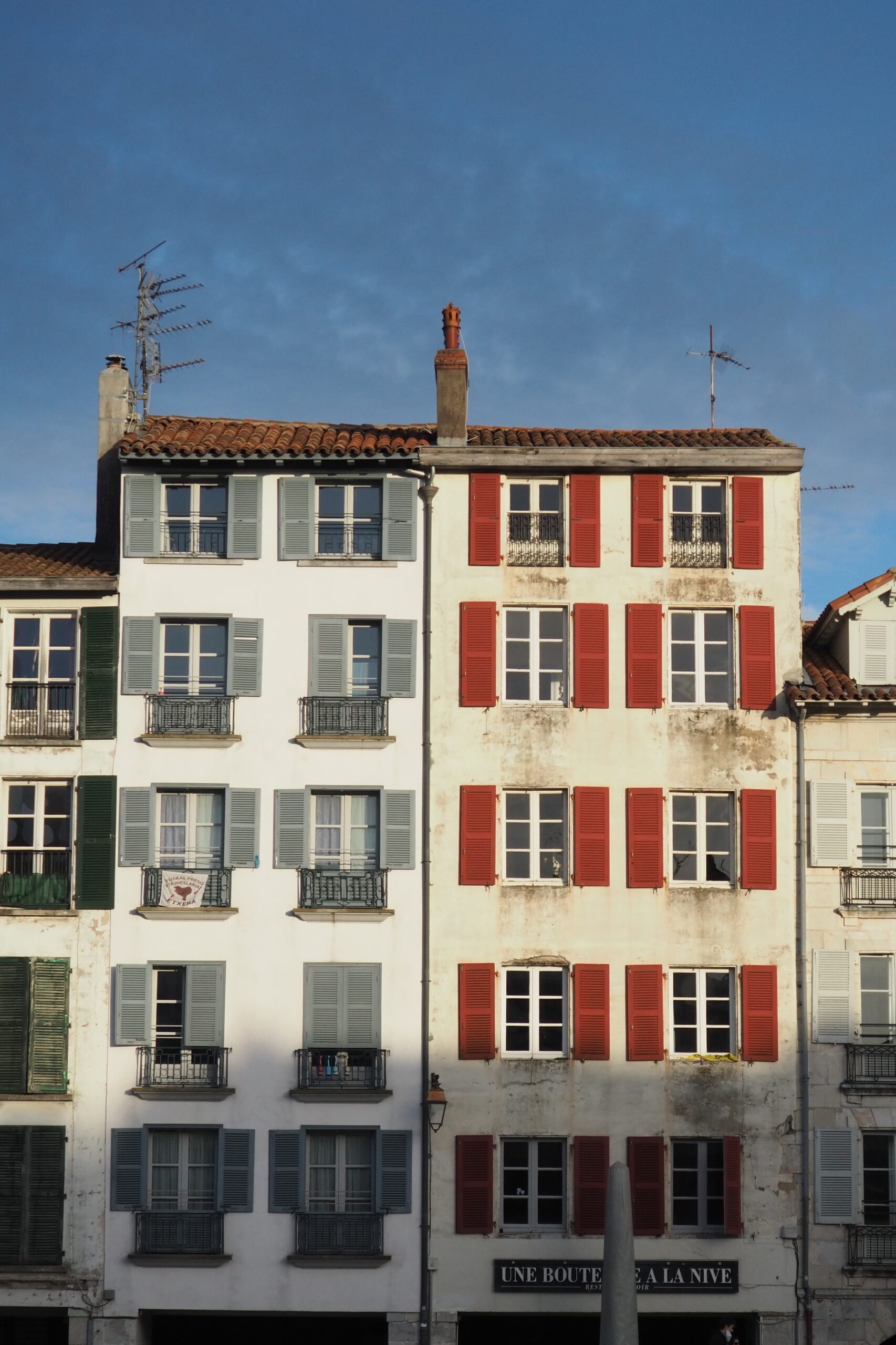 Premium Photo  Facade with doors and windows typical of the south of  france in the basque country bayonne