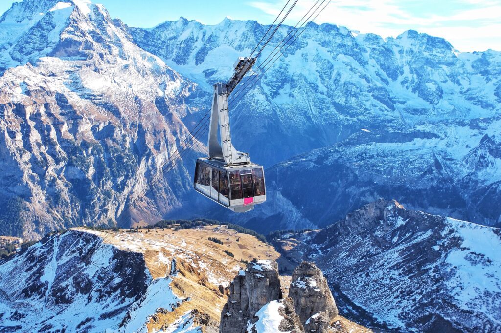 Cable cars over the Swiss Alps in Grindelwald Switzerland