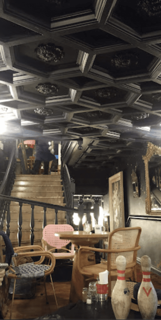neuvieme sauvage speakeasy in paris interior view of stairs 